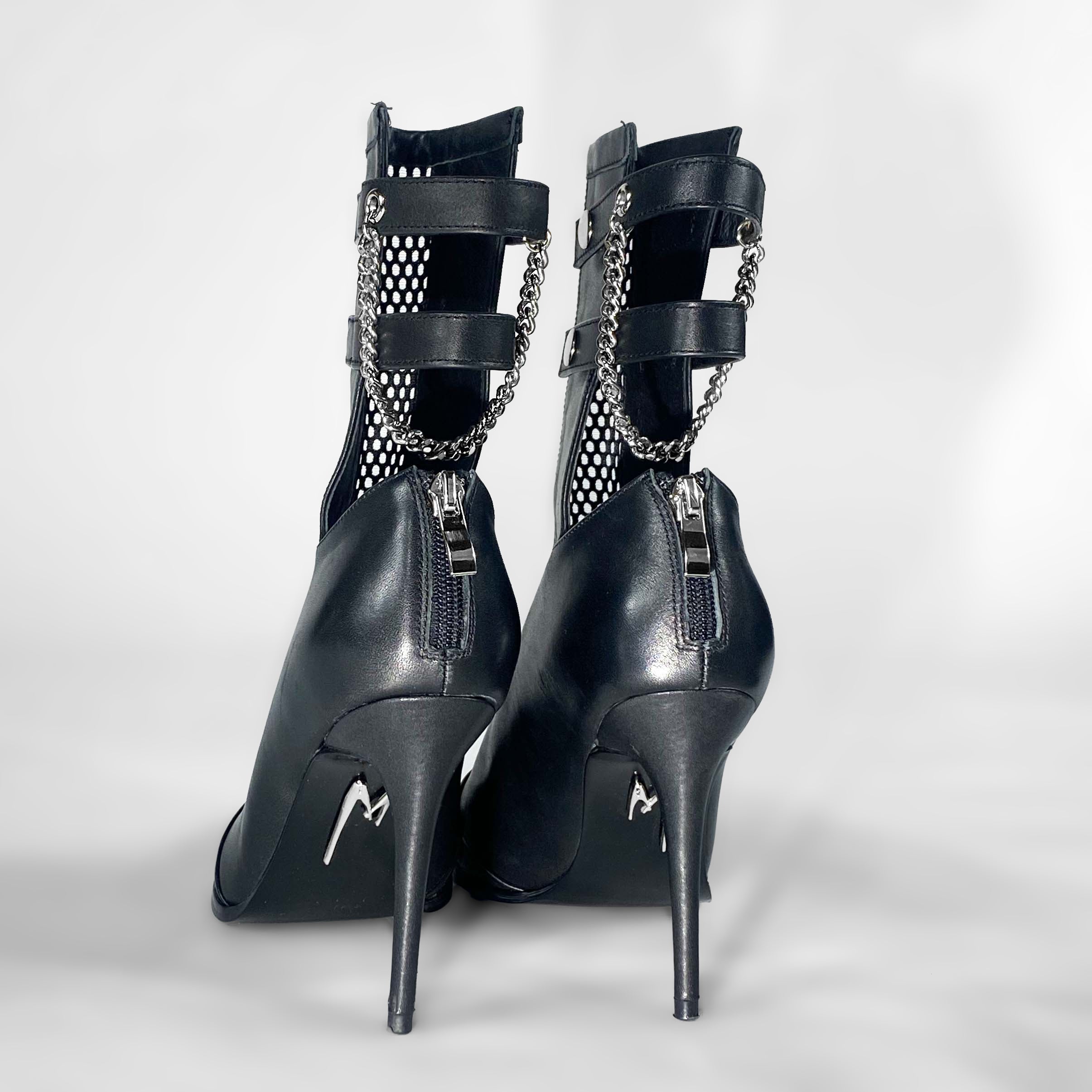 Black high heel leather boots, edgy luxury shoes with silver, back view